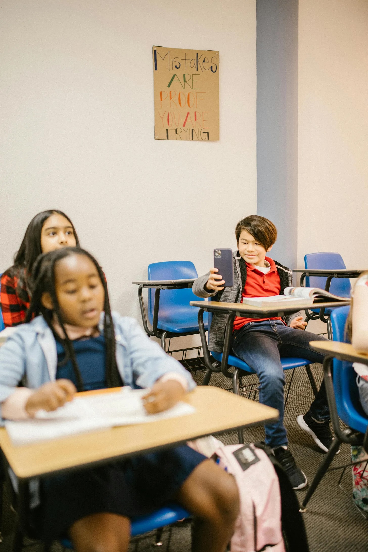 kids with phones in classroom