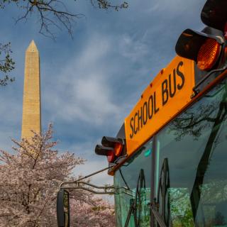picture of school bus and Washington Monumen